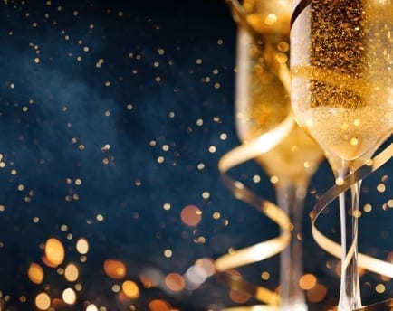 Celebration with wine glass for successful financial year at Alman Partners True Wealth Mackay & Brisbane