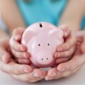 Hands holding a piggy bank, symbolising smart financial advice and saving strategies