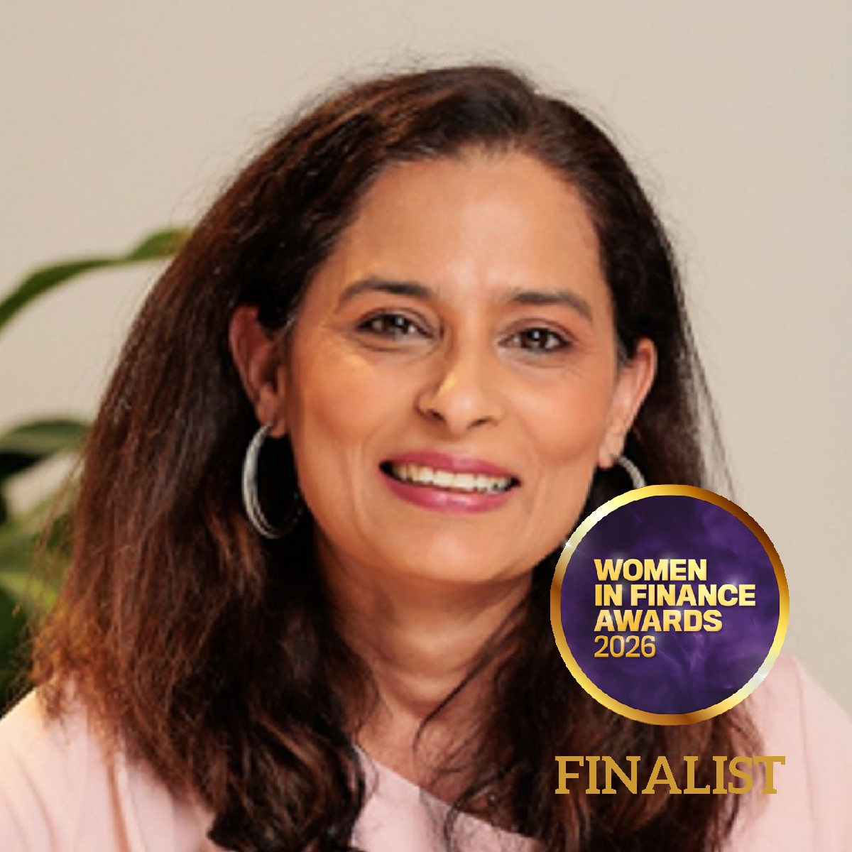 Head-and-shoulders portrait of a Niyati Khanna with shoulder-length dark hair, wearing a pale pink top and hoop earrings. The Women in Finance Awards 2026 logo appears alongside the word “Finalist”.