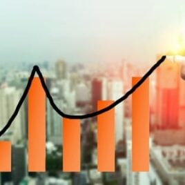 Hand drawing a rising financial graph over a city skyline – Financial advice on business growth, stock market trends, and investment success. Hand drawing a rising financial graph over a city skyline – Financial advice on business growth, stock market trends, and investment success.