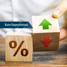 Hand holding percentage blocks with arrows – Financial advice on interest rate expectations and market trends Hand holding percentage blocks with arrows – Financial advice on interest rate expectations and market trends